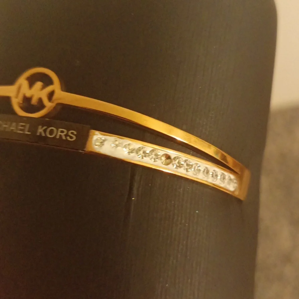 Michael Kors Rose gold tone and crystal rhinestone snap side women's bra…